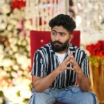 Bearded Brunette Sitting on Chair